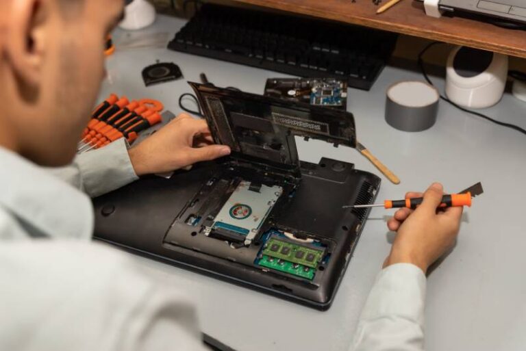 computer-repair-technician-repairing-a-laptop-2025-02-02-21-05-25-utc (2) (1)