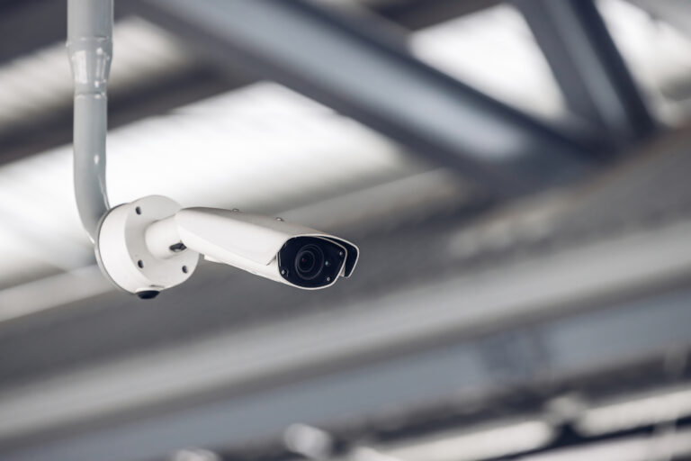 Online Security CCTV camera surveillance system outdoor of house. A blurred night city scape background. Real time Modern CCTV camera on a pole. Equipment system service for safety life or asset.