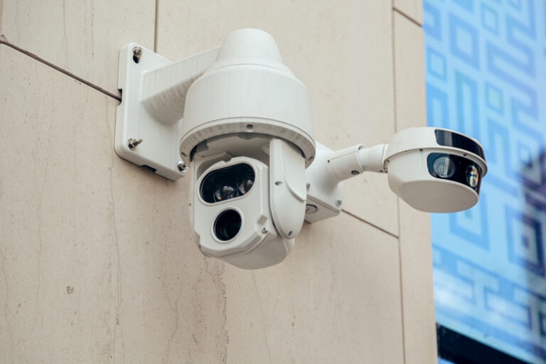 Several Modern CCTV cameras on wall. Concept of enhanced control surveillance and monitoring territory at corporate building